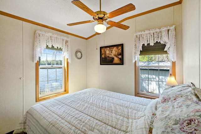 10412 Lakeside Dr, Pine Lake Twp, MN 55735 - bedroom featuring multiple windows, ornamental molding, vaulted ceiling, and a ceiling fan