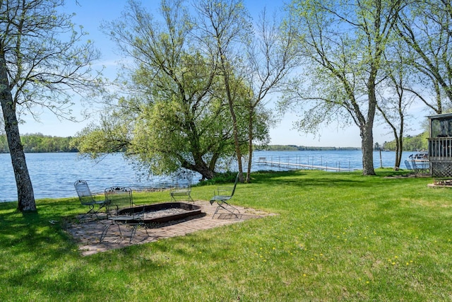 10412 Lakeside Dr, Pine Lake Twp, MN 55735 - view of green lawn featuring a water view and a fire pit