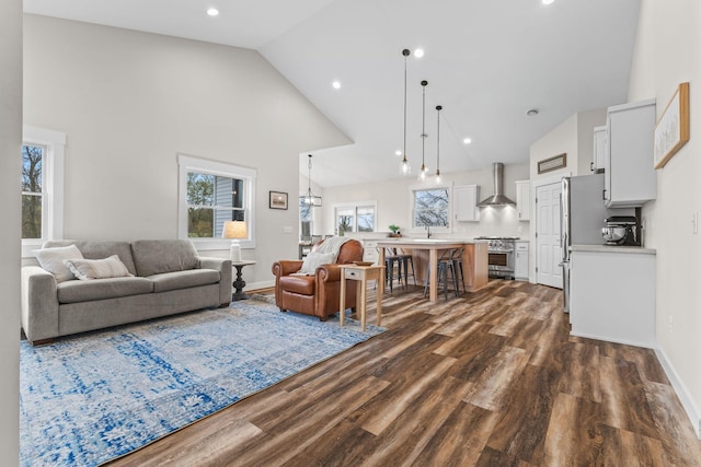 6359 313th Ave NE, North Branch, MN 55056 - living room featuring high vaulted ceiling, dark wood-type flooring, baseboards, and recessed lighting