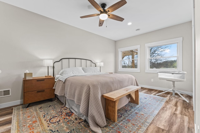 6359 313th Ave NE, North Branch, MN 55056 - bedroom featuring baseboards, wood finished floors, a ceiling fan, and recessed lighting