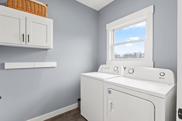 6359 313th Ave NE, North Branch, MN 55056 - clothes washing area with washer and clothes dryer, cabinet space, baseboards, and dark wood-type flooring