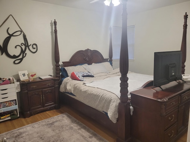 bedroom featuring wood finished floors