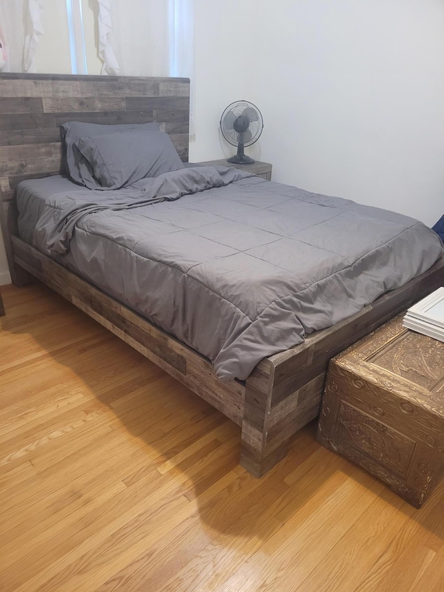 bedroom featuring light wood-style floors