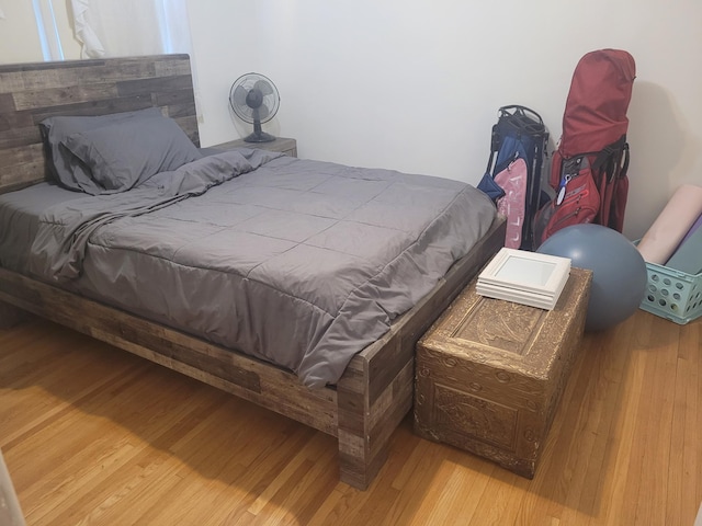 bedroom featuring wood finished floors