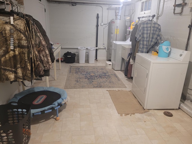 washroom with separate washer and dryer and electric water heater