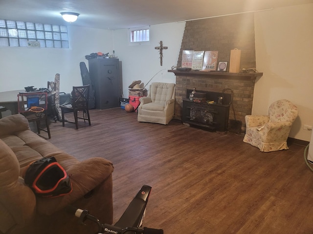 living area with wood finished floors and a fireplace