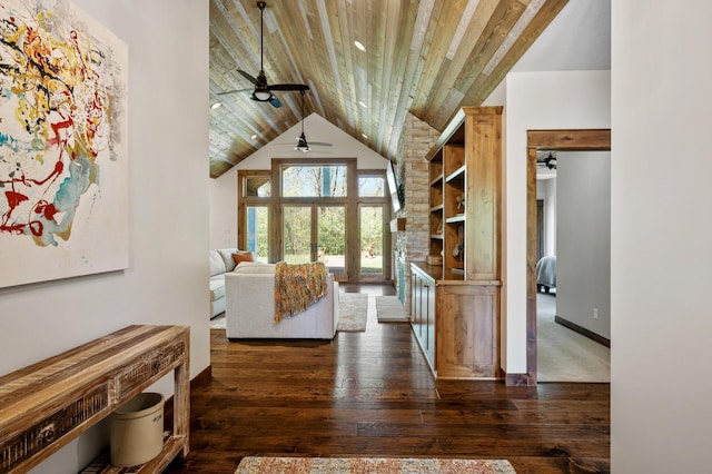 living area with ceiling fan, wood ceiling, baseboards, wood-type flooring, and high vaulted ceiling