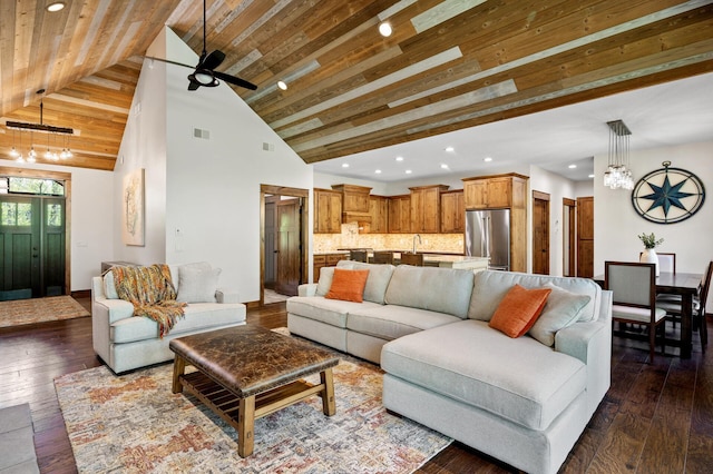 living area with recessed lighting, dark wood finished floors, a ceiling fan, wooden ceiling, and a chandelier