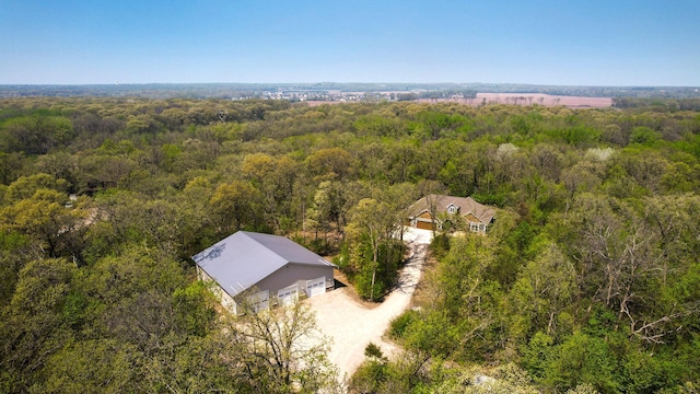 view from above of property with a forest