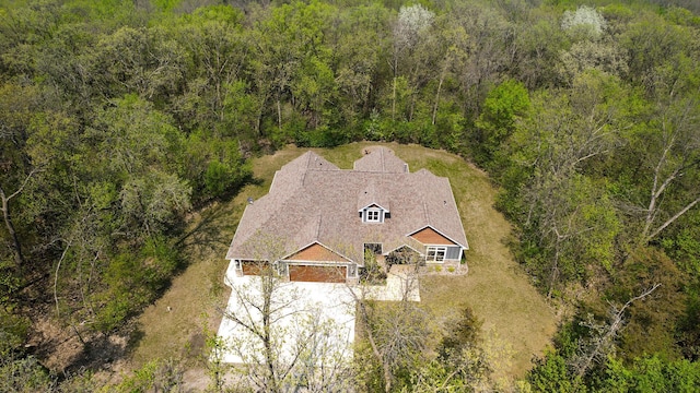 view of subject property with a forest