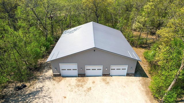 view from above of property featuring a forest