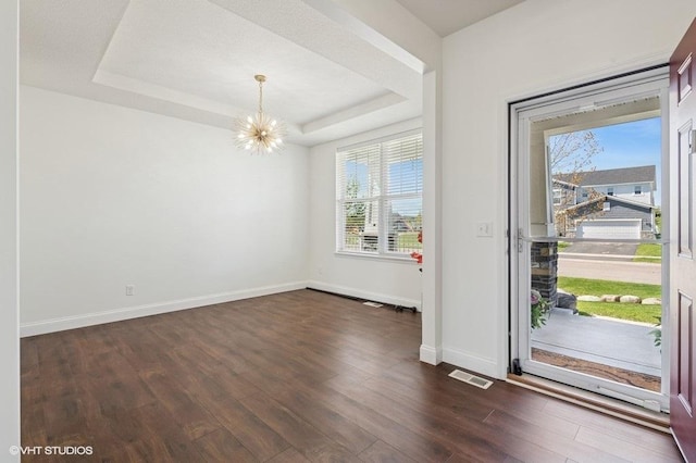 3618 112th Cir NE, Blaine, MN 55449 - entrance foyer with a chandelier, plenty of natural light, dark wood finished floors, and baseboards