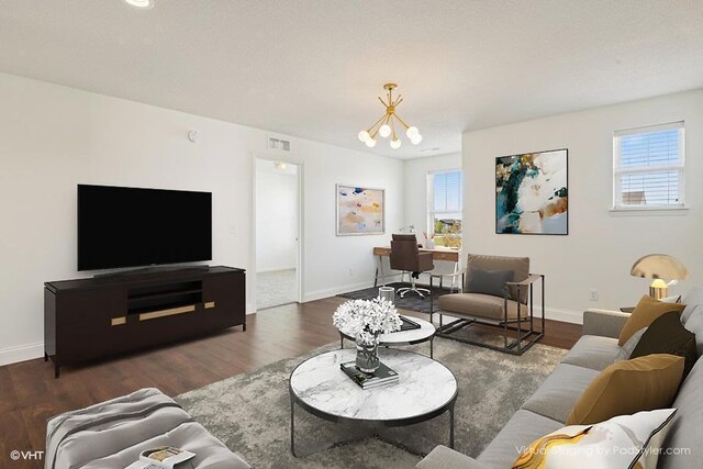 3618 112th Cir NE, Blaine, MN 55449 - living area with a chandelier, plenty of natural light, wood finished floors, and baseboards