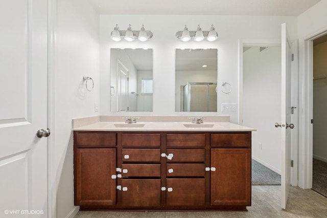 3618 112th Cir NE, Blaine, MN 55449 - bathroom featuring a shower stall, double vanity, and a spacious closet