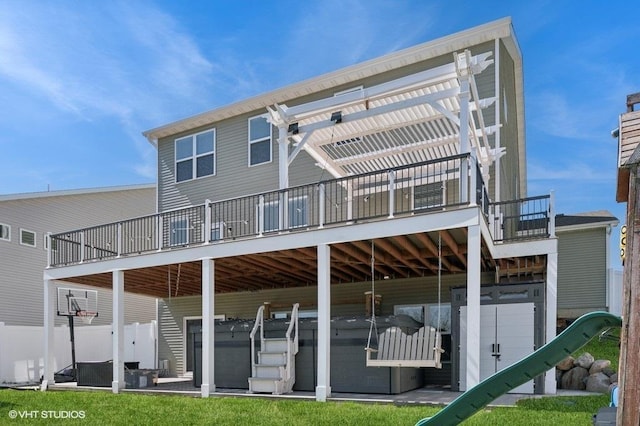 3618 112th Cir NE, Blaine, MN 55449 - rear view of house with a pergola, a wooden deck, and a hot tub