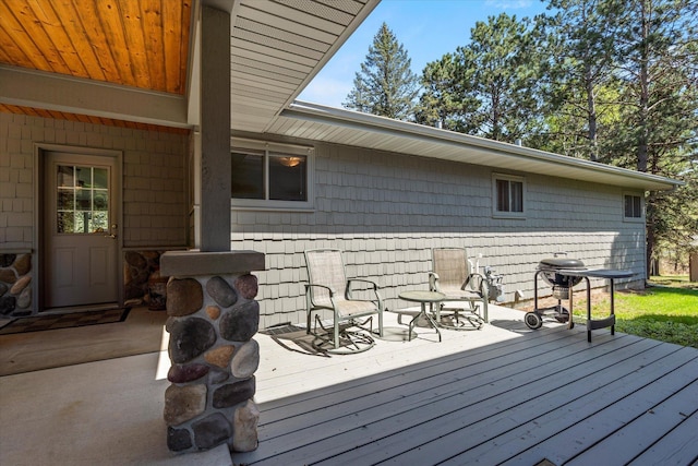 wooden terrace with area for grilling