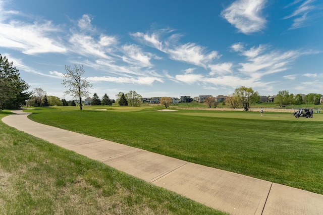 surrounding community featuring a lawn