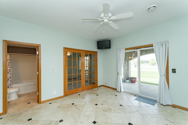 doorway to outside featuring french doors, baseboards, and ceiling fan