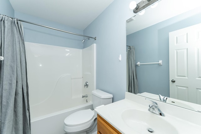 full bath featuring toilet, vanity, and shower / bath combo