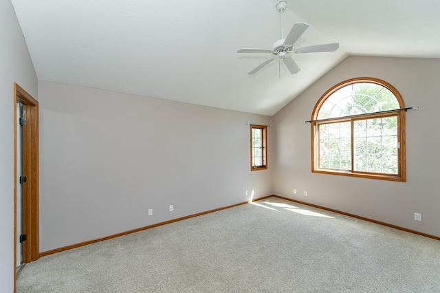1463 Belvior Ln NE, Byron, MN 55920 - spare room featuring plenty of natural light, ceiling fan, vaulted ceiling, baseboards, and carpet flooring