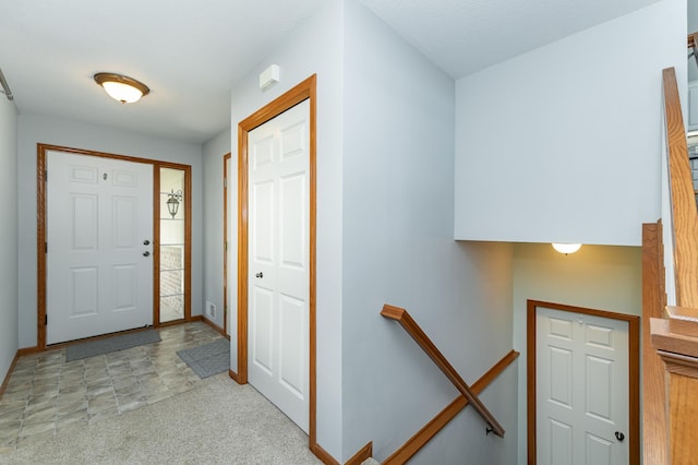 1463 Belvior Ln NE, Byron, MN 55920 - entryway featuring baseboards and light carpet