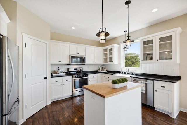 13985 120th St N, Stillwater Twp, MN 55082 - kitchen with appliances with stainless steel finishes, white cabinets, dark wood finished floors, and recessed lighting