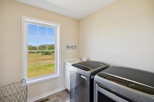 13985 120th St N, Stillwater Twp, MN 55082 - laundry room with washer and clothes dryer and baseboards