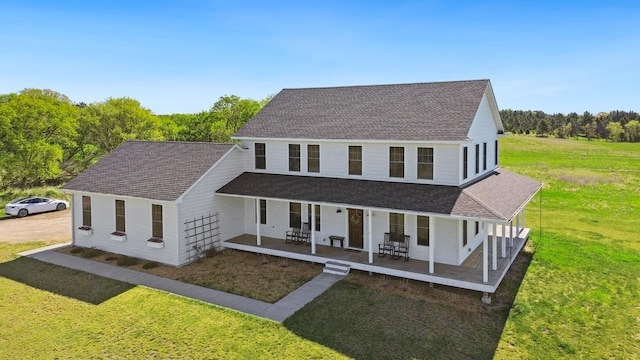 13985 120th St N, Stillwater Twp, MN 55082 - view of front facade with covered porch, a shingled roof, and a front yard