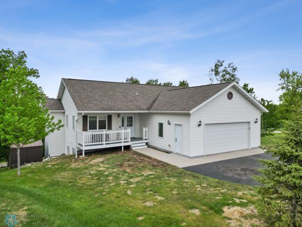 1171 Long Bridge Cir, Detroit Lakes, MN 56501 - single story home with an attached garage, a front lawn, and asphalt driveway