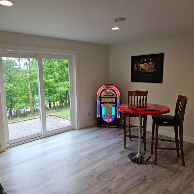 1171 Long Bridge Cir, Detroit Lakes, MN 56501 - dining area featuring wood finished floors, baseboards, and recessed lighting