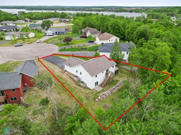 1171 Long Bridge Cir, Detroit Lakes, MN 56501 - aerial perspective of suburban area featuring property boundaries highlighted and a nearby body of water