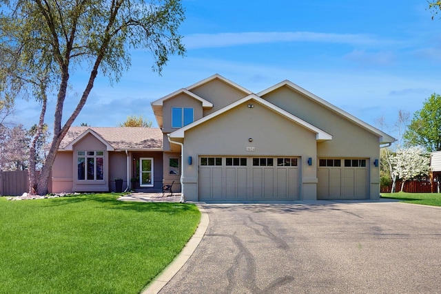 11604 72nd Ave N, Maple Grove, MN 55369 - traditional-style home with stucco siding, driveway, and an attached garage