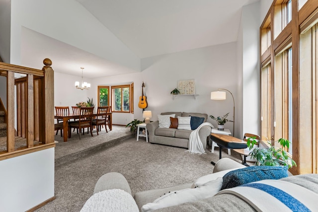living area featuring stairs, carpet, a chandelier, and high vaulted ceiling