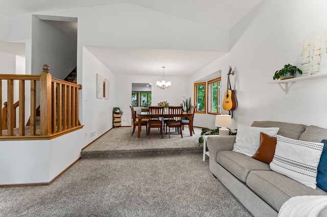 carpeted living room with a chandelier, vaulted ceiling, stairs, and baseboards