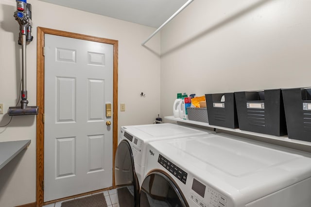 laundry room with independent washer and dryer and tile patterned floors