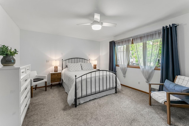bedroom featuring light carpet, baseboards, and ceiling fan