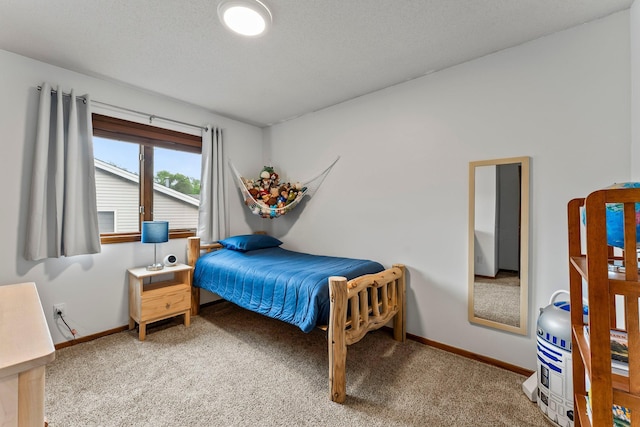 bedroom featuring light colored carpet and baseboards
