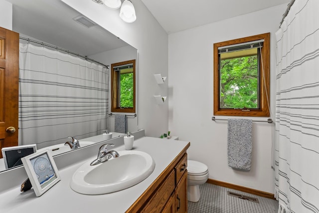 full bath featuring vanity, toilet, baseboards, tile patterned flooring, and a shower with shower curtain