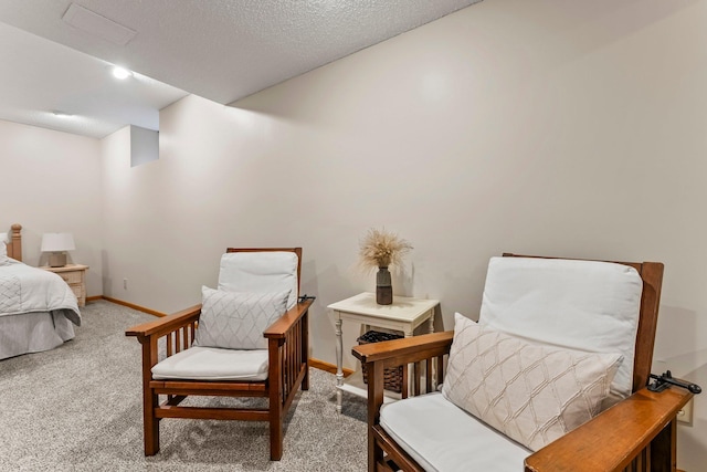 carpeted bedroom featuring baseboards