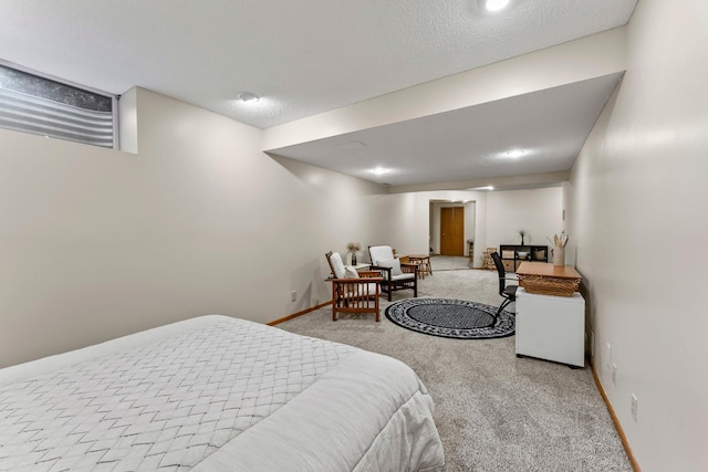 bedroom featuring carpet and baseboards