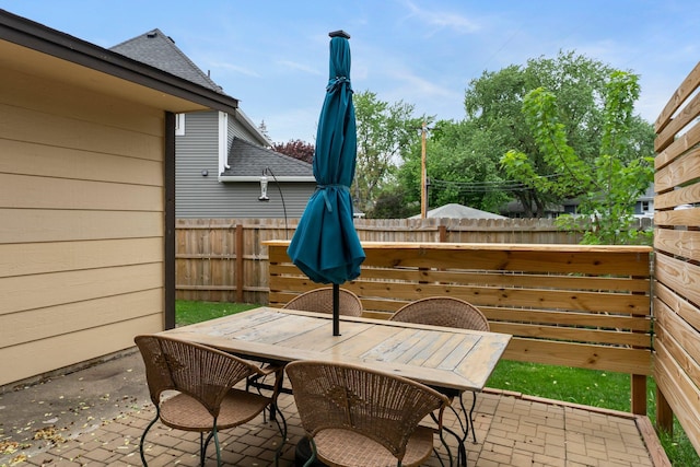 view of patio / terrace featuring fence and outdoor dining space