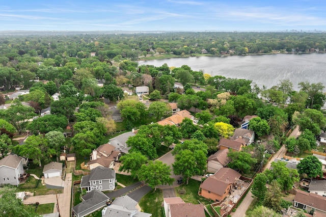 aerial view of residential area featuring a nearby body of water