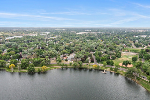 aerial view of a large body of water and a tree filled landscape