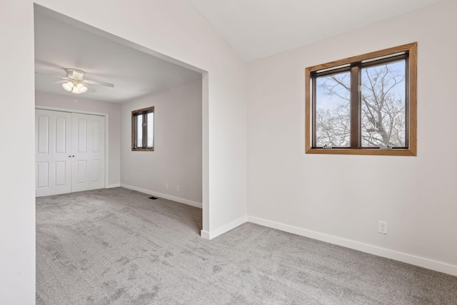 19835 County Road 30, Corcoran, MN 55340 - spare room featuring carpet flooring, baseboards, and ceiling fan