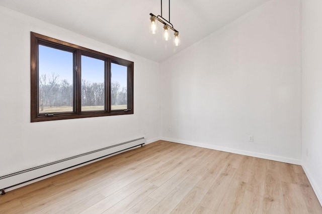 19835 County Road 30, Corcoran, MN 55340 - empty room featuring baseboard heating, light wood-type flooring, and baseboards
