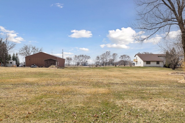19835 County Road 30, Corcoran, MN 55340 - view of green lawn with a pole building, an outbuilding, and a rural view