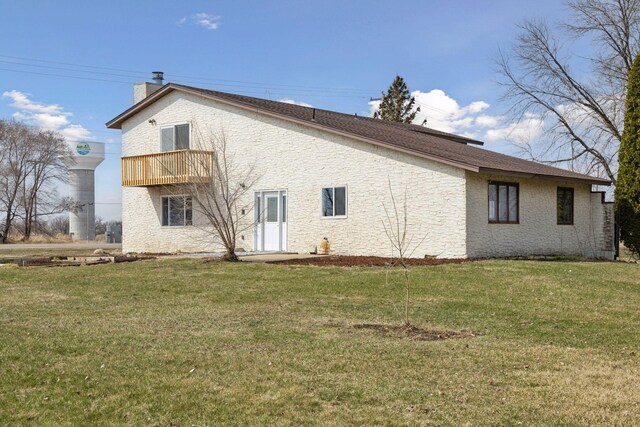 19835 County Road 30, Corcoran, MN 55340 - view of side of home with a balcony, a chimney, and a lawn