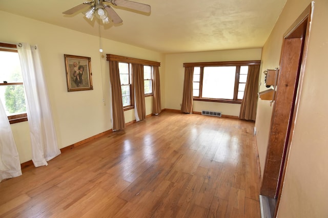 321 1st Ave SW, Baudette, MN 56623 - empty room featuring light wood-style floors, a ceiling fan, and baseboards