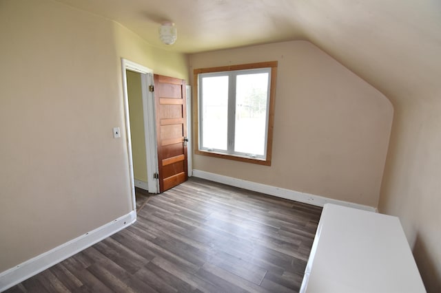321 1st Ave SW, Baudette, MN 56623 - bonus room with lofted ceiling, dark wood-type flooring, and baseboards