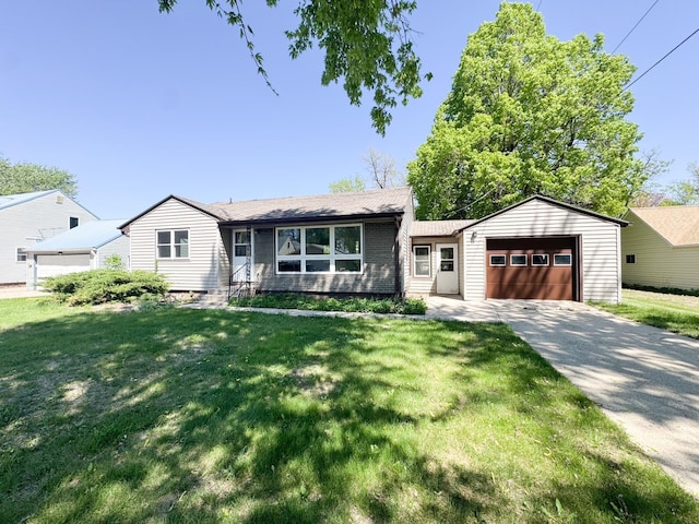 ranch-style home with a garage, a front lawn, and concrete driveway